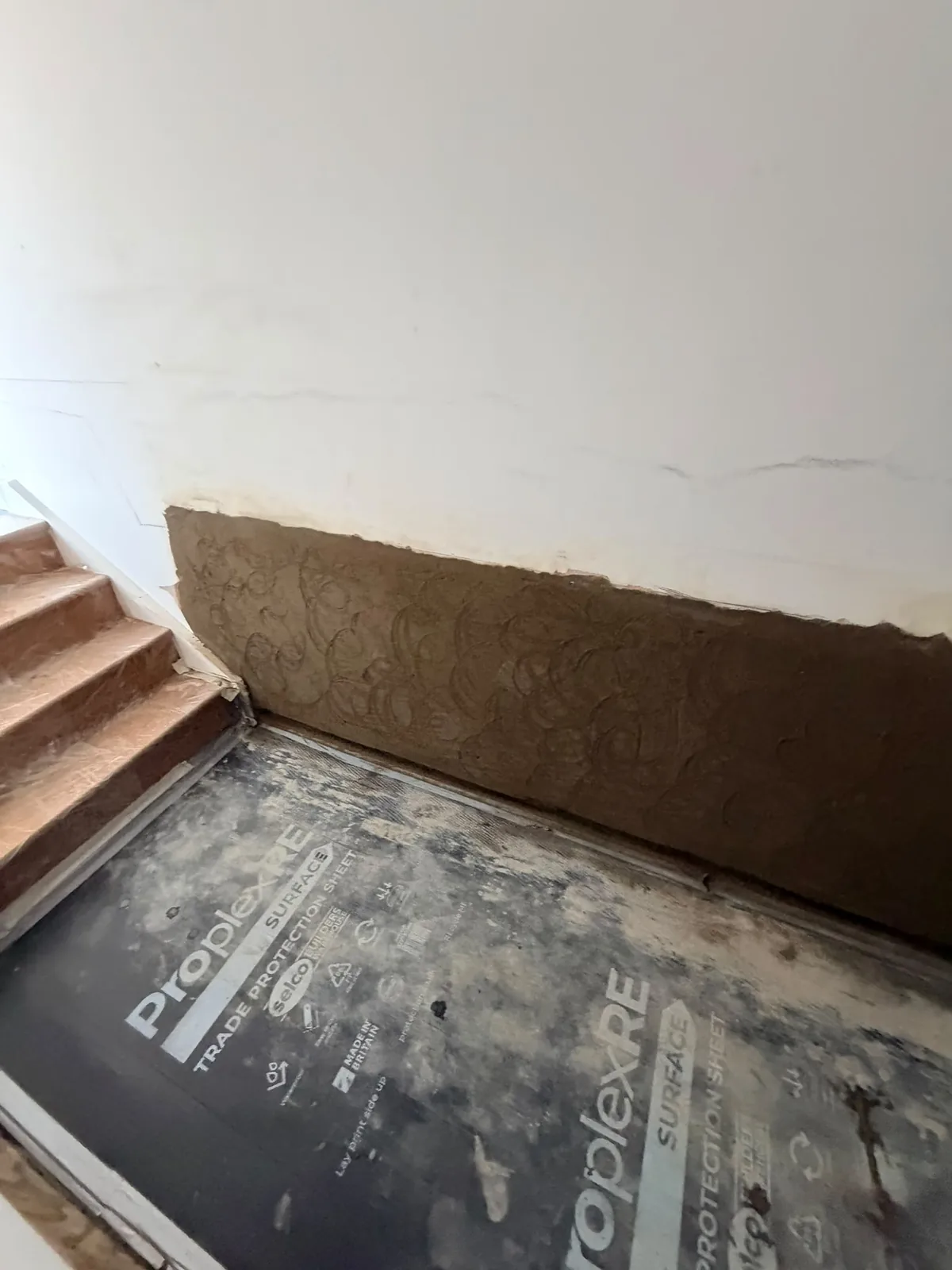 Damp-affected internal wall before Sherifi Group treatment