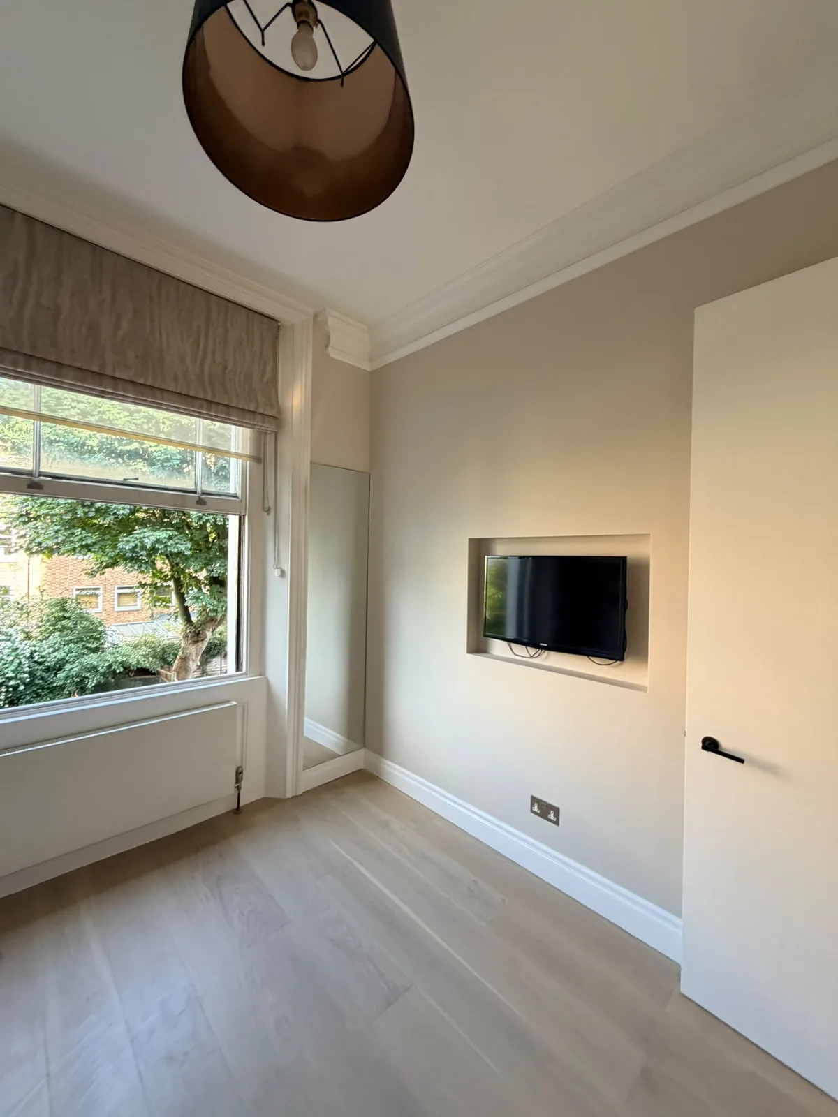 Completed London living room after Sherifi Group property-care work
